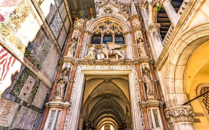 Entrance of the Doge's Palace with ornate sculptures in Piazza San Marco, Venice.