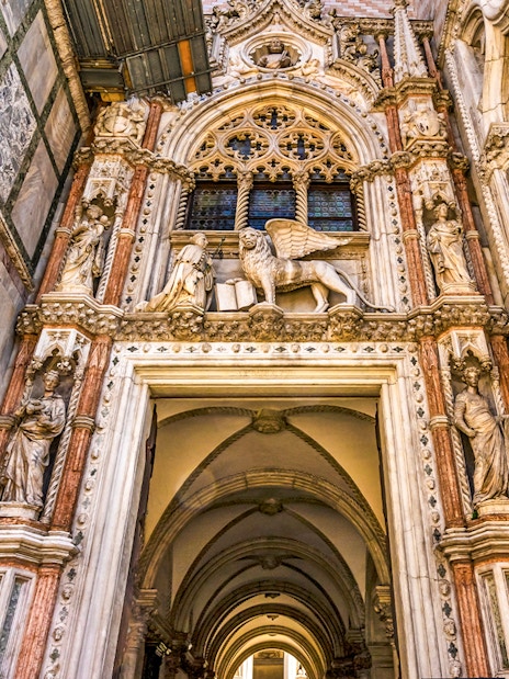 Entrance of the Doge's Palace with ornate sculptures in Piazza San Marco, Venice.