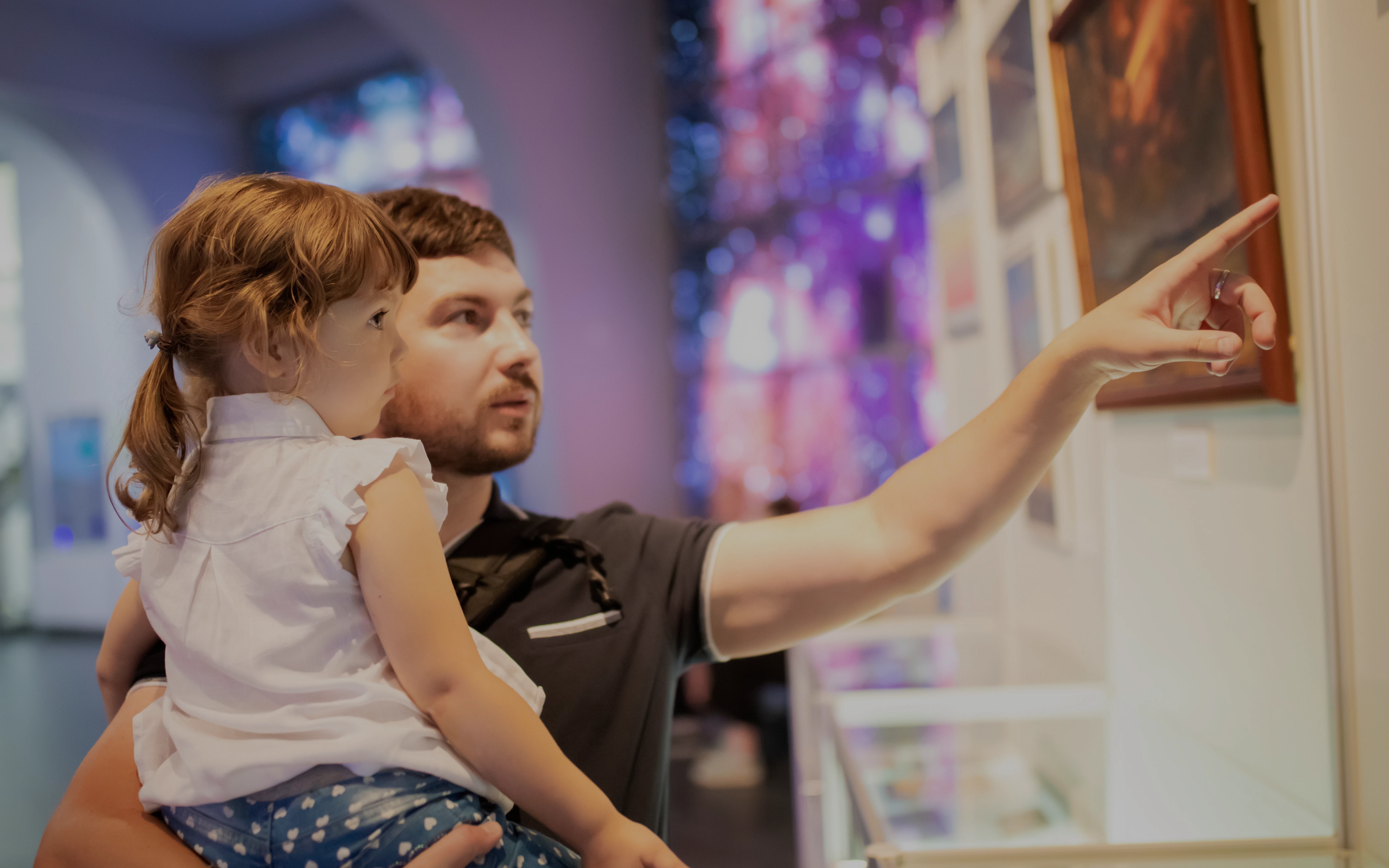 Father and child exploring exhibits