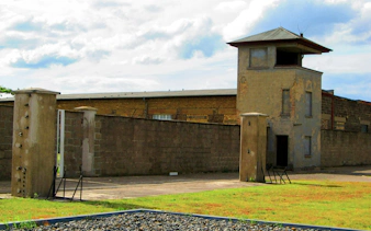 Sachsenhausen concentration camp watchtower and perimeter wall in Oranienburg, Germany.