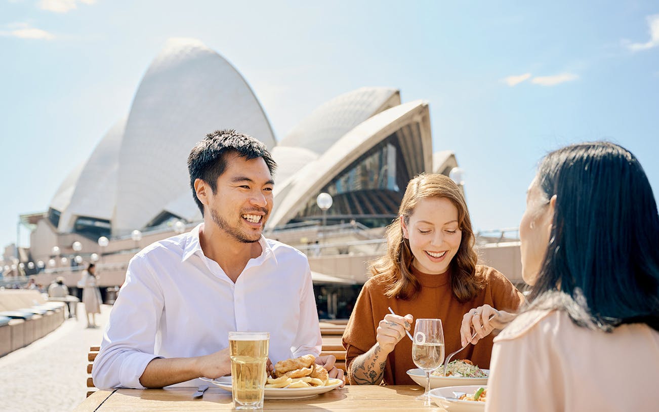 Dining at Sydney Opera House during guided tour with meals and drinks.