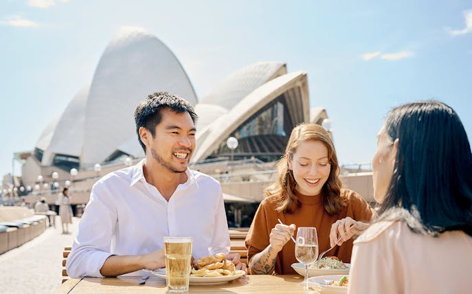 Dining at Sydney Opera House during guided tour with meals and drinks.