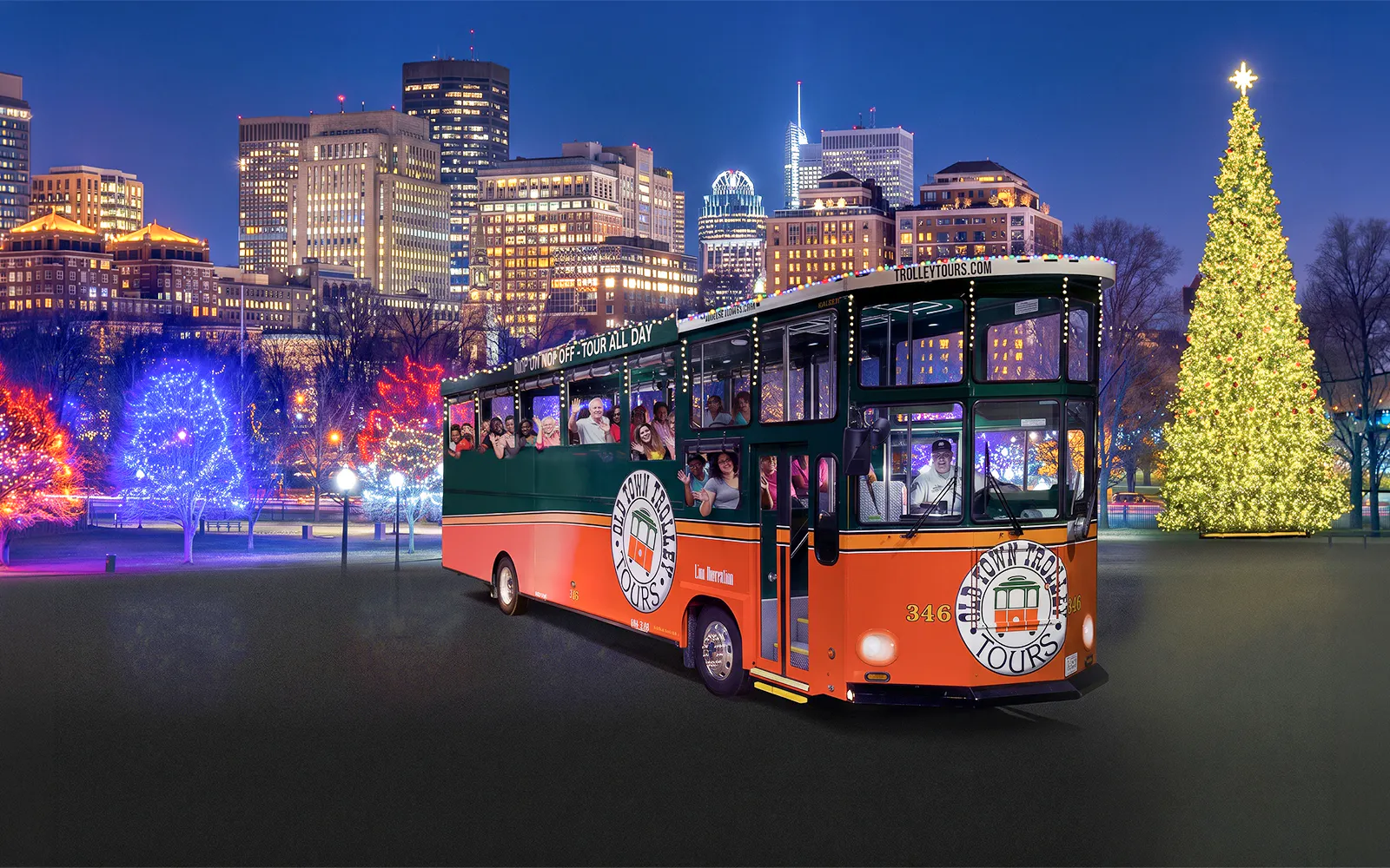 Trolley tour in Boston with festive lights and a large Christmas tree.