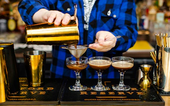 Bartender preparing cocktails during Seattle Happy Hour Tour.