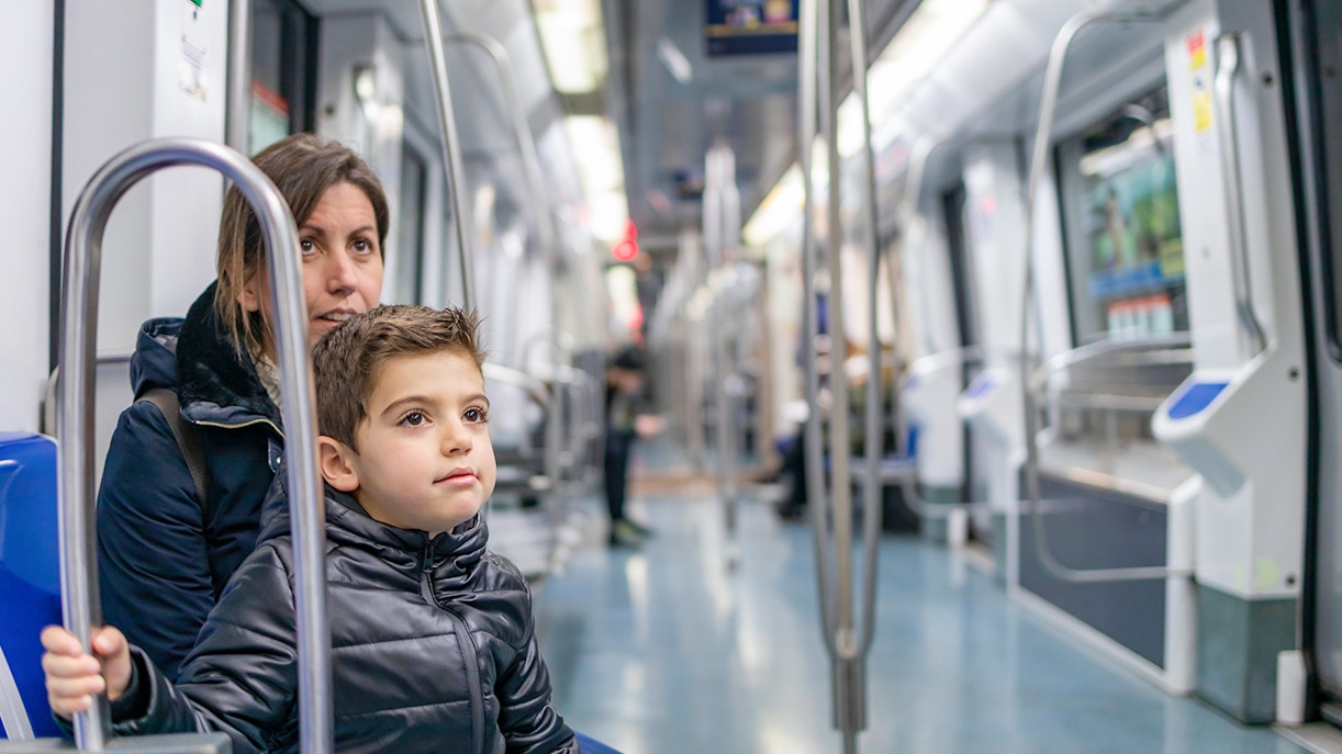 Mother and son travelling on the metro