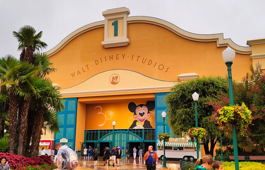 Walt Disney Studios entrance with iconic Mickey Mouse statue in Marne-la-Vallée, France.
