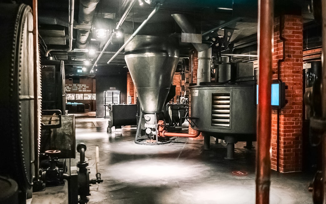 Vodka distillation equipment inside Krakow Vodka Factory Museum.