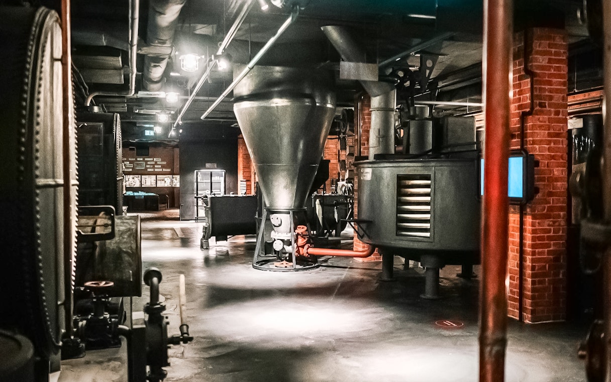Vodka distillation equipment inside Krakow Vodka Factory Museum.