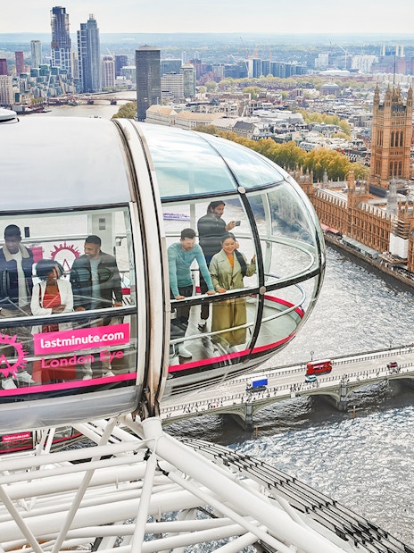 London Eye capsule overlooking the River Thames and Houses of Parliament, London.