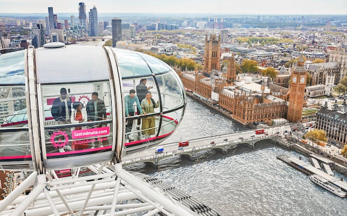 London Eye capsule overlooking the River Thames and Houses of Parliament, London.