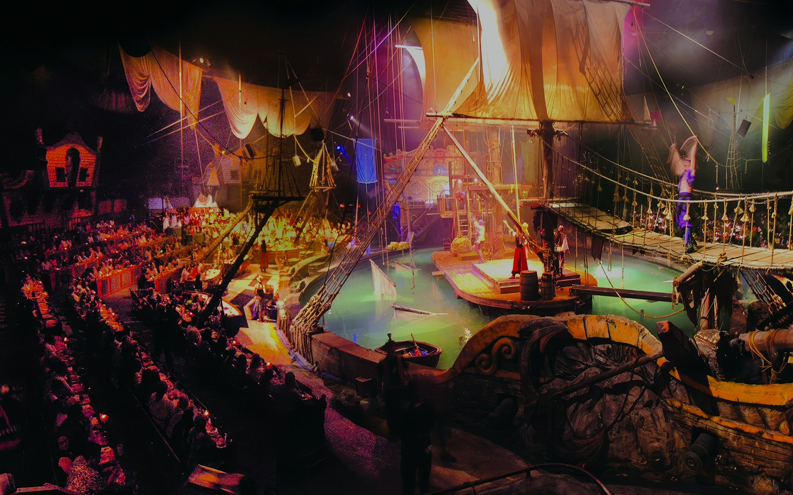Pirate ship stage with performers at Pirates Dinner Adventure Show.