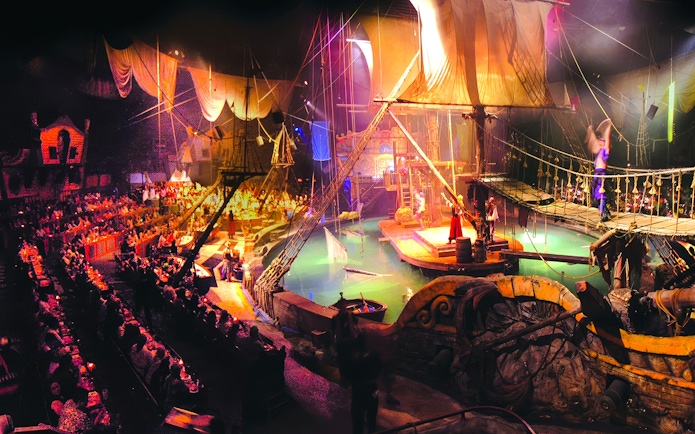Pirate ship stage with performers at Pirates Dinner Adventure Show.