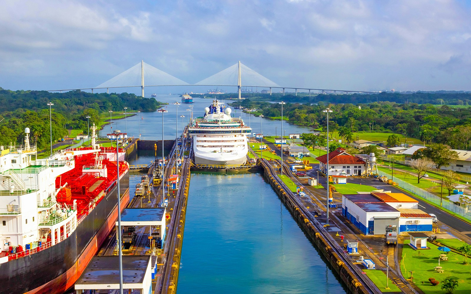 Panama Canal view from hop-on hop-off bus tour, showcasing ships passing through locks.