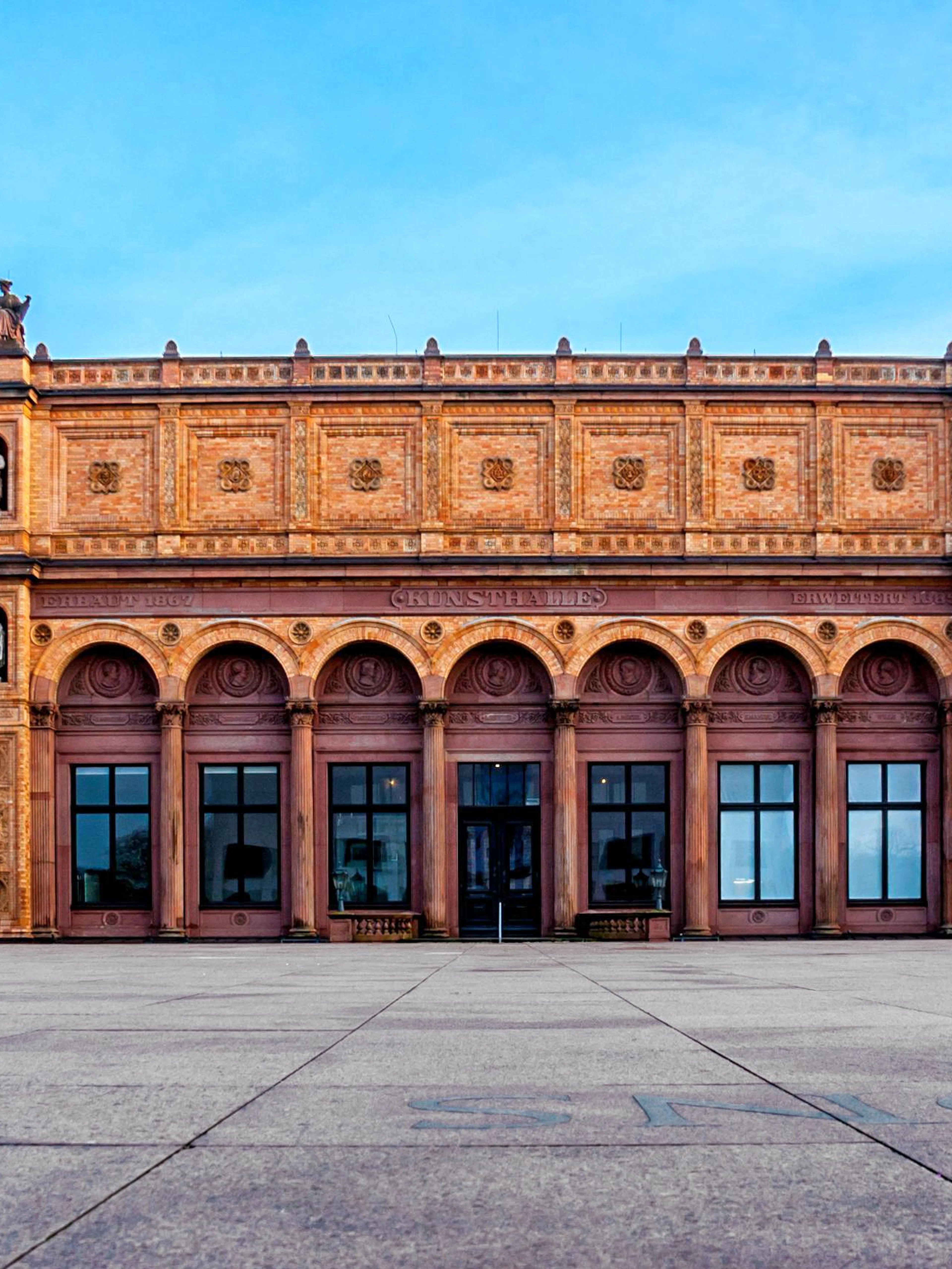 Hamburg Kunsthalle facade with arched windows and statues, Germany.