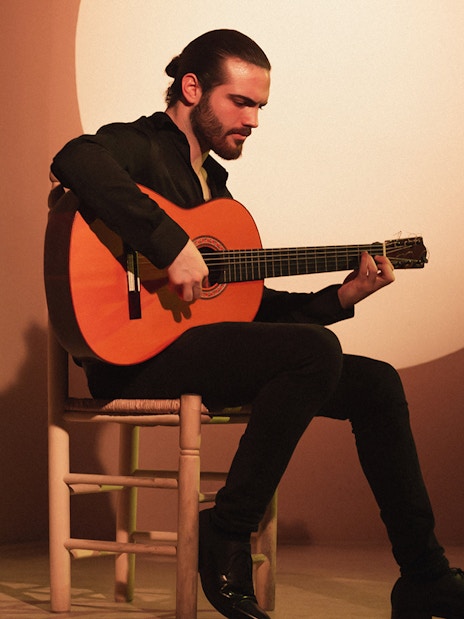Guitarist performing at a flamenco show in Madrid.