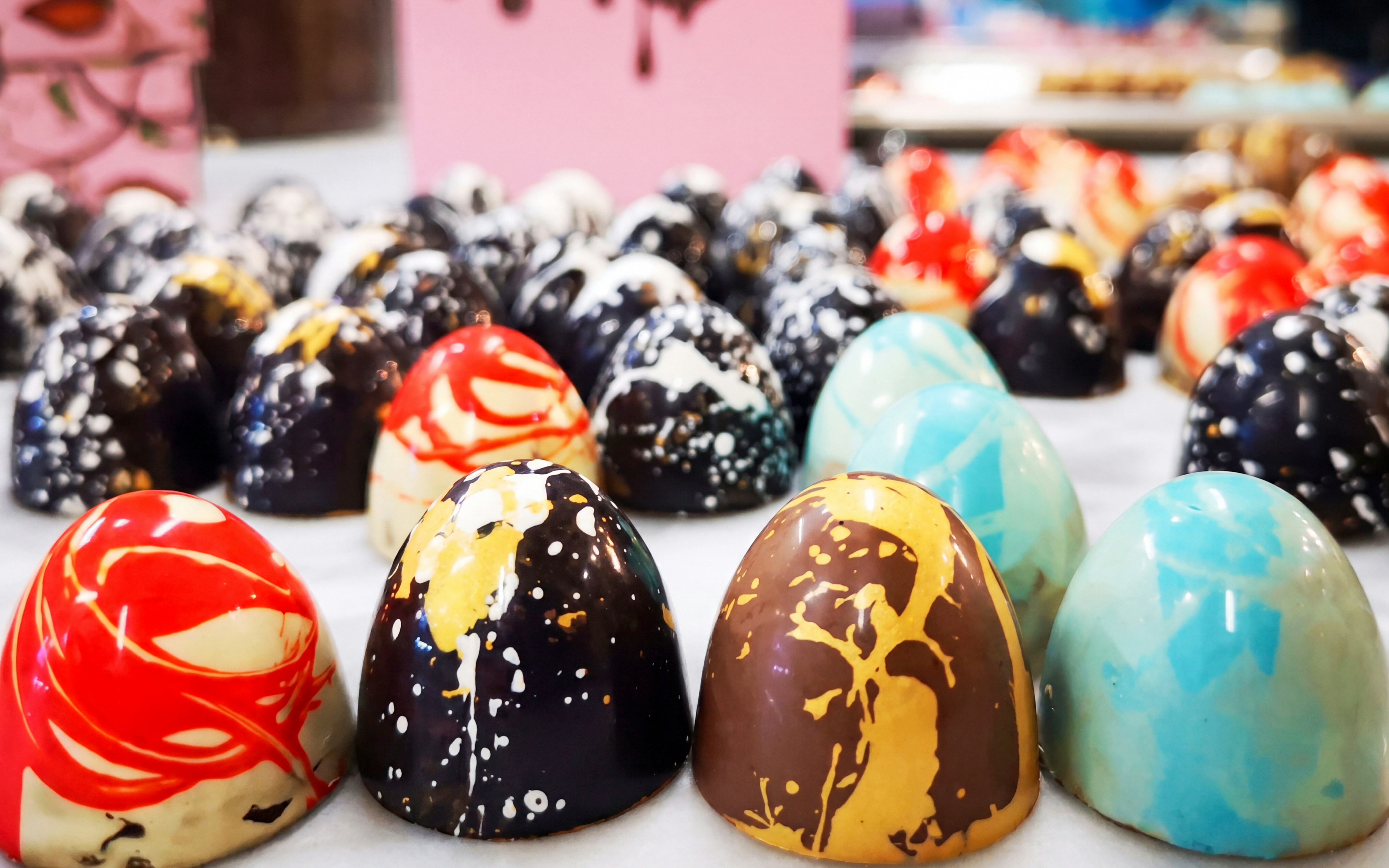 Colorful artisan chocolates on display at the Chocolate Museum in Vienna.