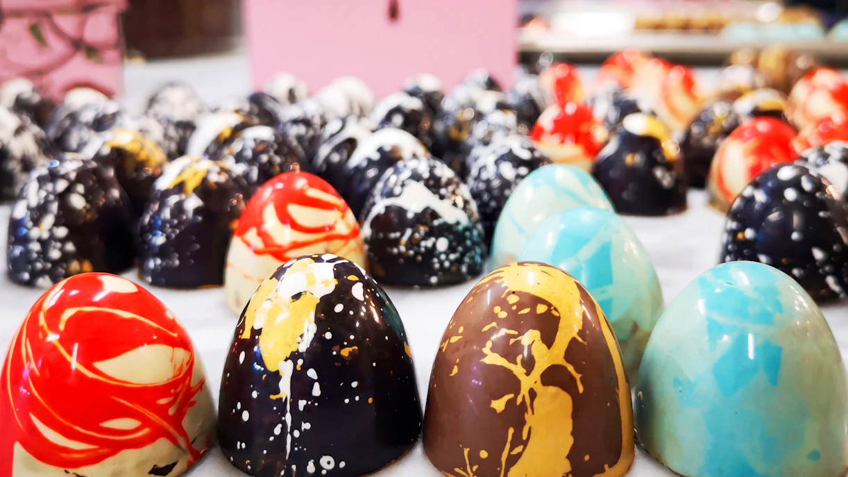Colorful artisan chocolates on display at the Chocolate Museum in Vienna.