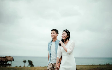 Couple enjoying a professional photoshoot by the sea in Lombok.