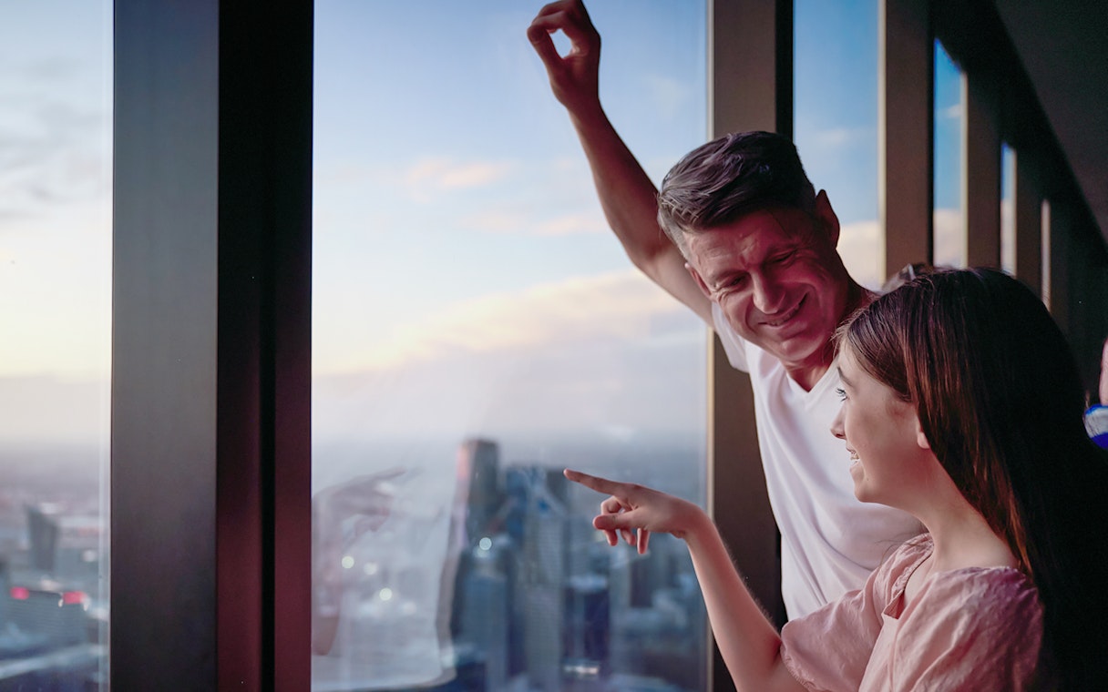 Visitors enjoying the view from Melbourne Skydeck during the Edge Experience.