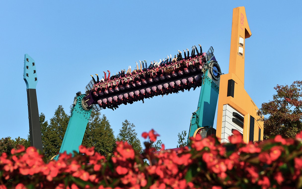 Riders upside down on a colorful thrill ride at Everland Theme Park, South Korea.