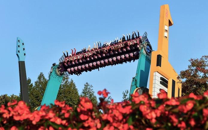 Riders upside down on a colorful thrill ride at Everland Theme Park, South Korea.