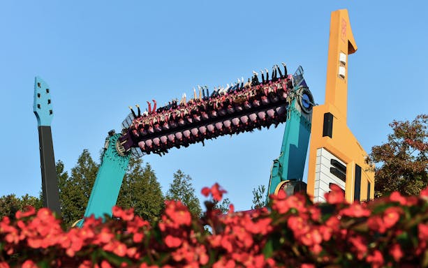 Riders upside down on a colorful thrill ride at Everland Theme Park, South Korea.