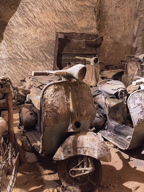Abandoned scooters and cars in Naples Underground cave.