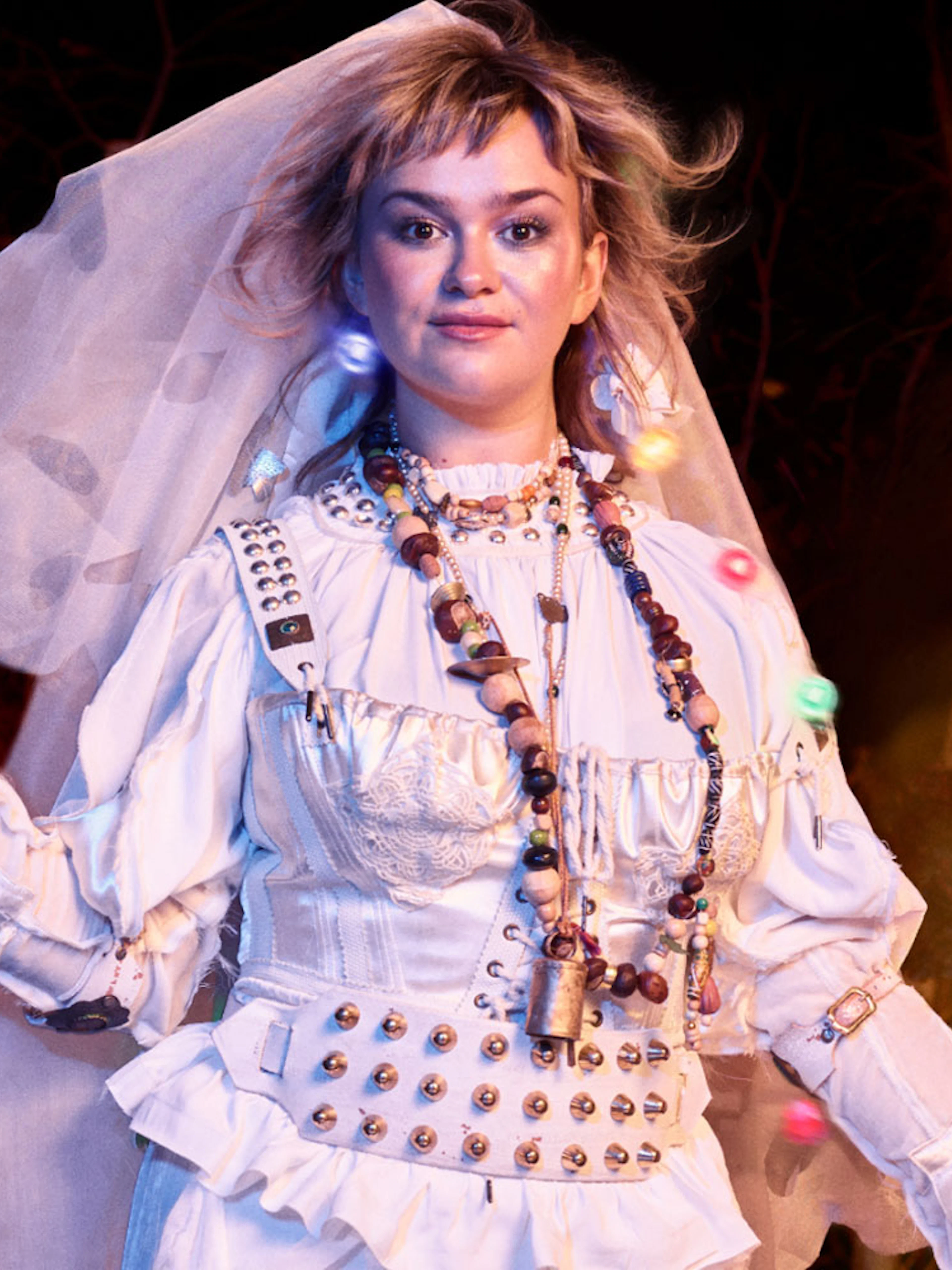 Performer in costume for "As You Like It" at West End theater.