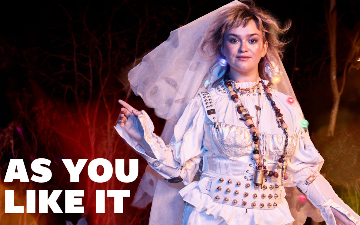 Performer in costume for "As You Like It" at West End theater.
