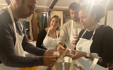 Participants making mozzarella at Amalfi Coast farmhouse cooking class.