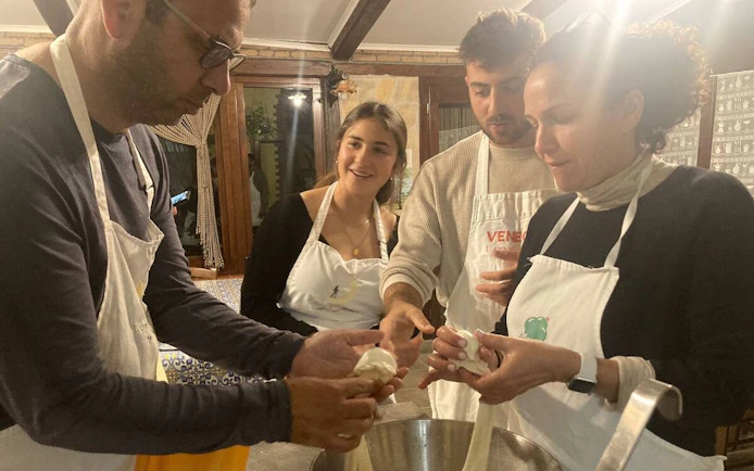 Participants making mozzarella at Amalfi Coast farmhouse cooking class.