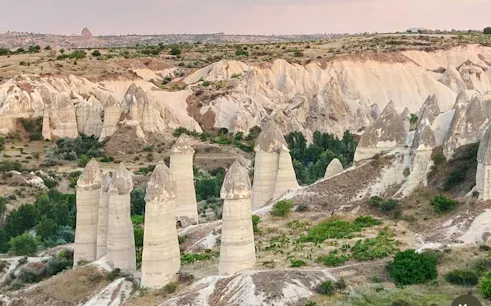 Fairy chimneys in Cappadocia landscape during private tour with English and Japanese guide.