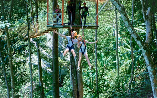 Ziplining through lush forest at Erawan Patong Seaview, Phuket.