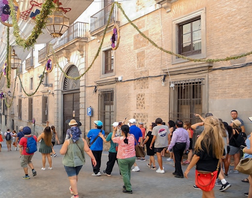 Toledo guided tour participants exploring historic architecture.