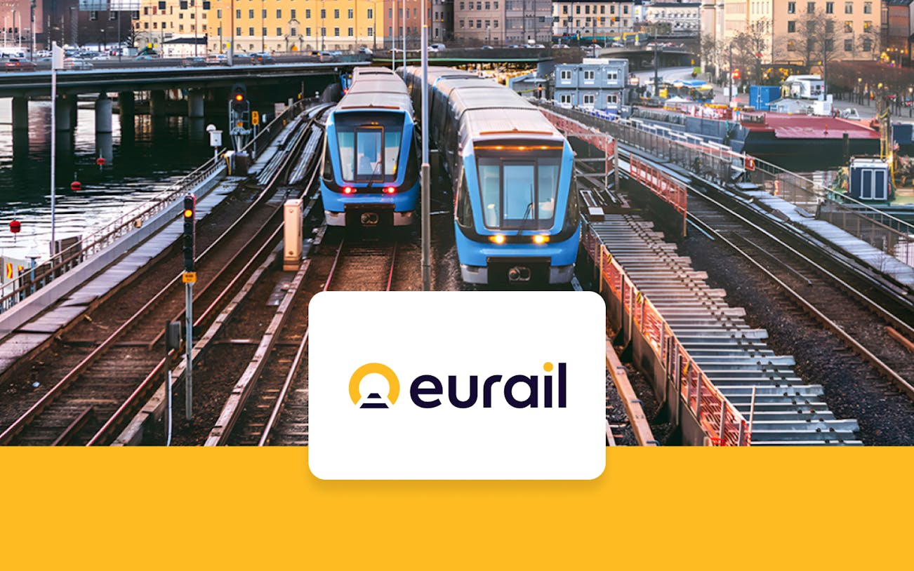 Eurail trains on tracks in a European city, promoting Eurail Global Mobile Pass Flex.