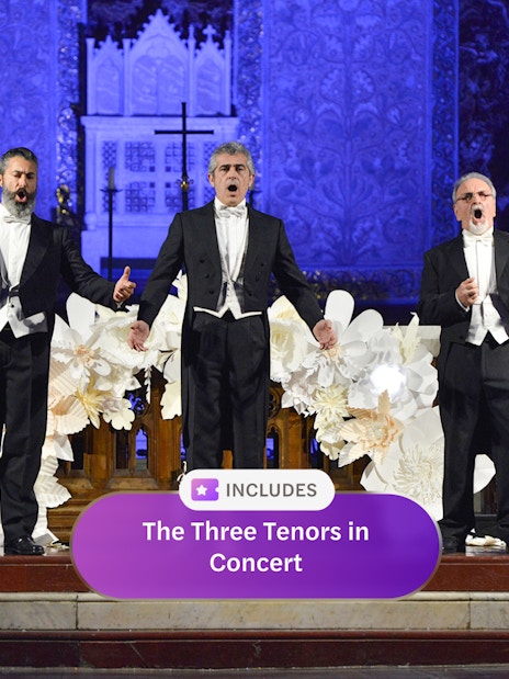 Three tenors performing on stage in Rome concert hall.