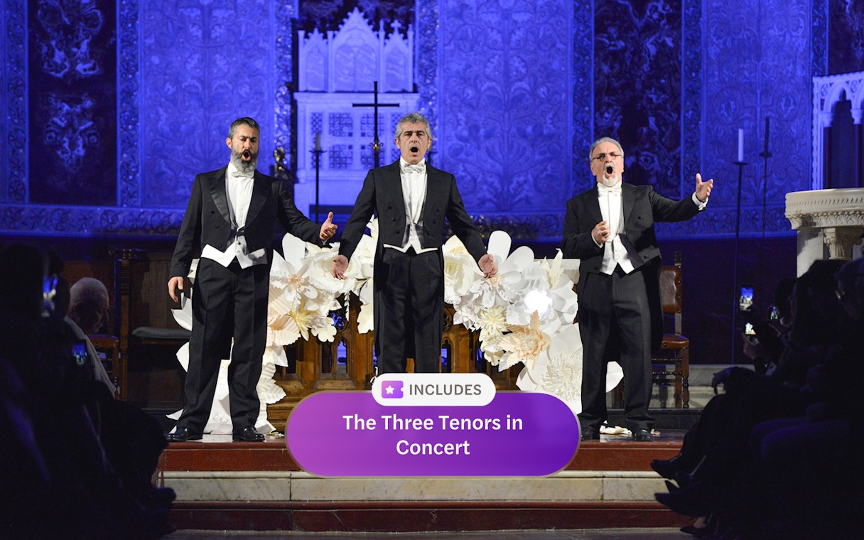 Three tenors performing on stage in Rome concert hall.
