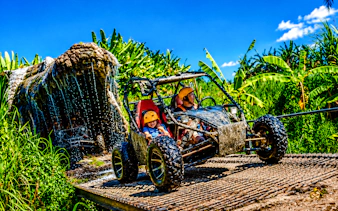 Buggy driving through Crocodile Cave with jungle backdrop in Ubud, Bali.