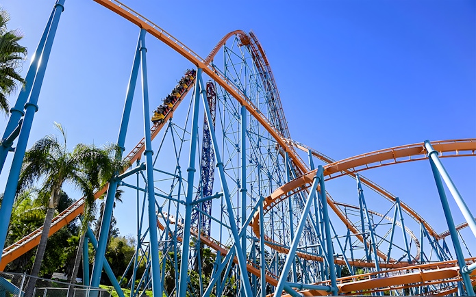 Roller coaster at Six Flags Magic Mountain with blue sky backdrop.