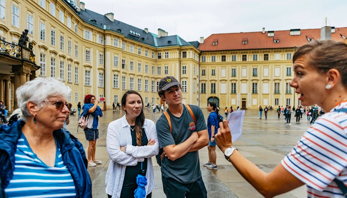 Guide with visitors on the Old Town Square in Prague