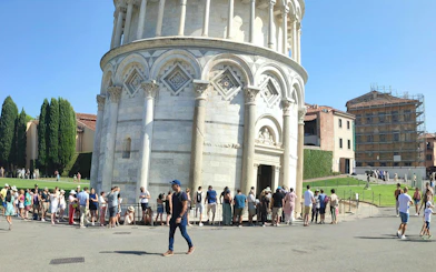 Tourists lined up to enter the Leaning Tower of Pisa, Italy.