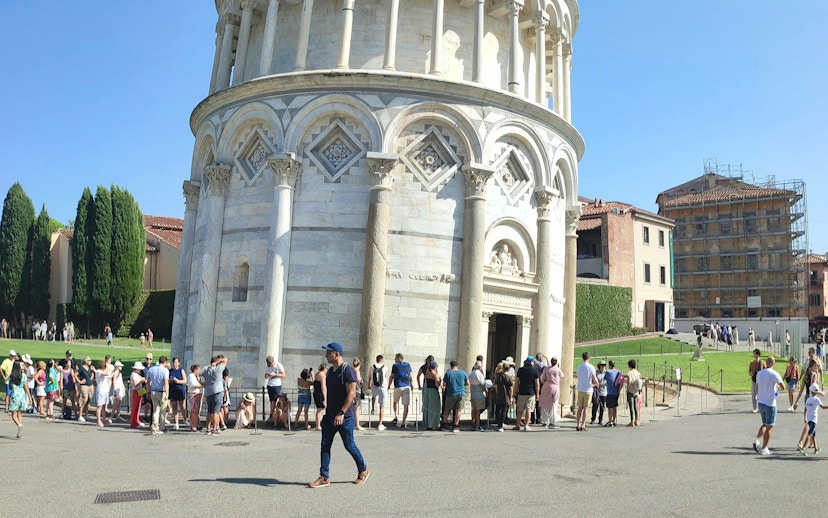 Tourists lined up to enter the Leaning Tower of Pisa, Italy.