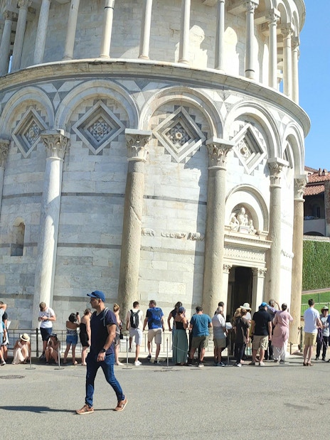 Tourists lined up to enter the Leaning Tower of Pisa, Italy.