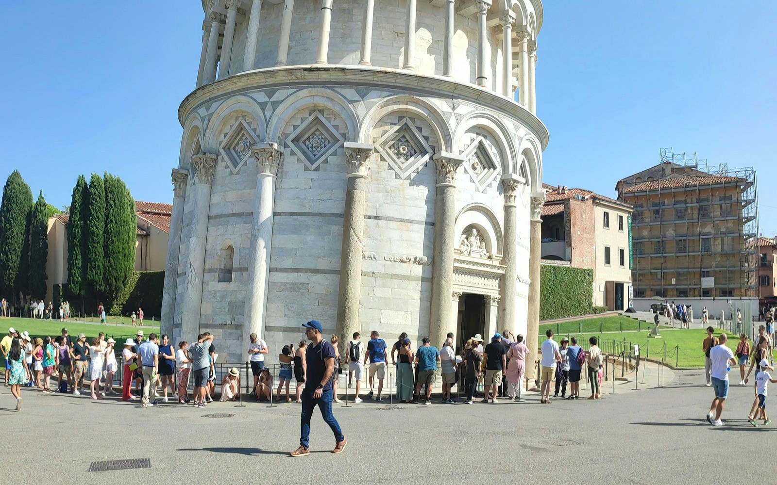 Tourists lined up to enter the Leaning Tower of Pisa, Italy.