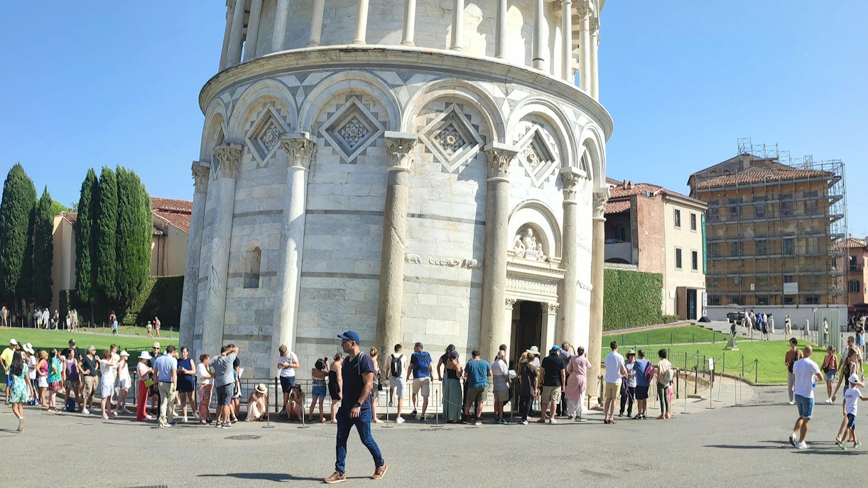 Tourists lined up to enter the Leaning Tower of Pisa, Italy.
