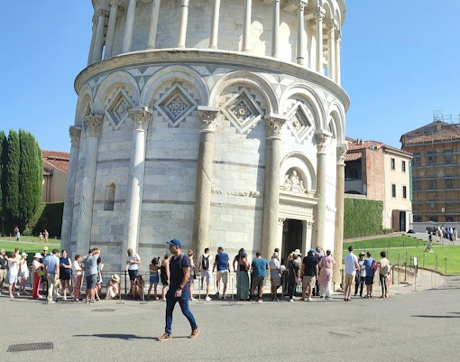 Tourists lined up to enter the Leaning Tower of Pisa, Italy.