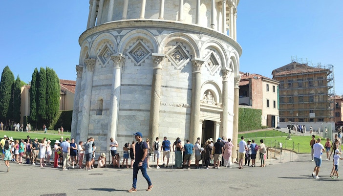Tourists lined up to enter the Leaning Tower of Pisa, Italy.