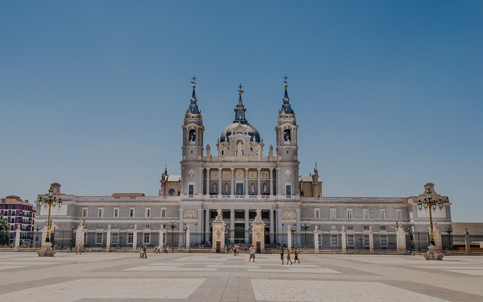 Almudena Cathedral exterior in Madrid, Spain, showcasing its neoclassical architecture.