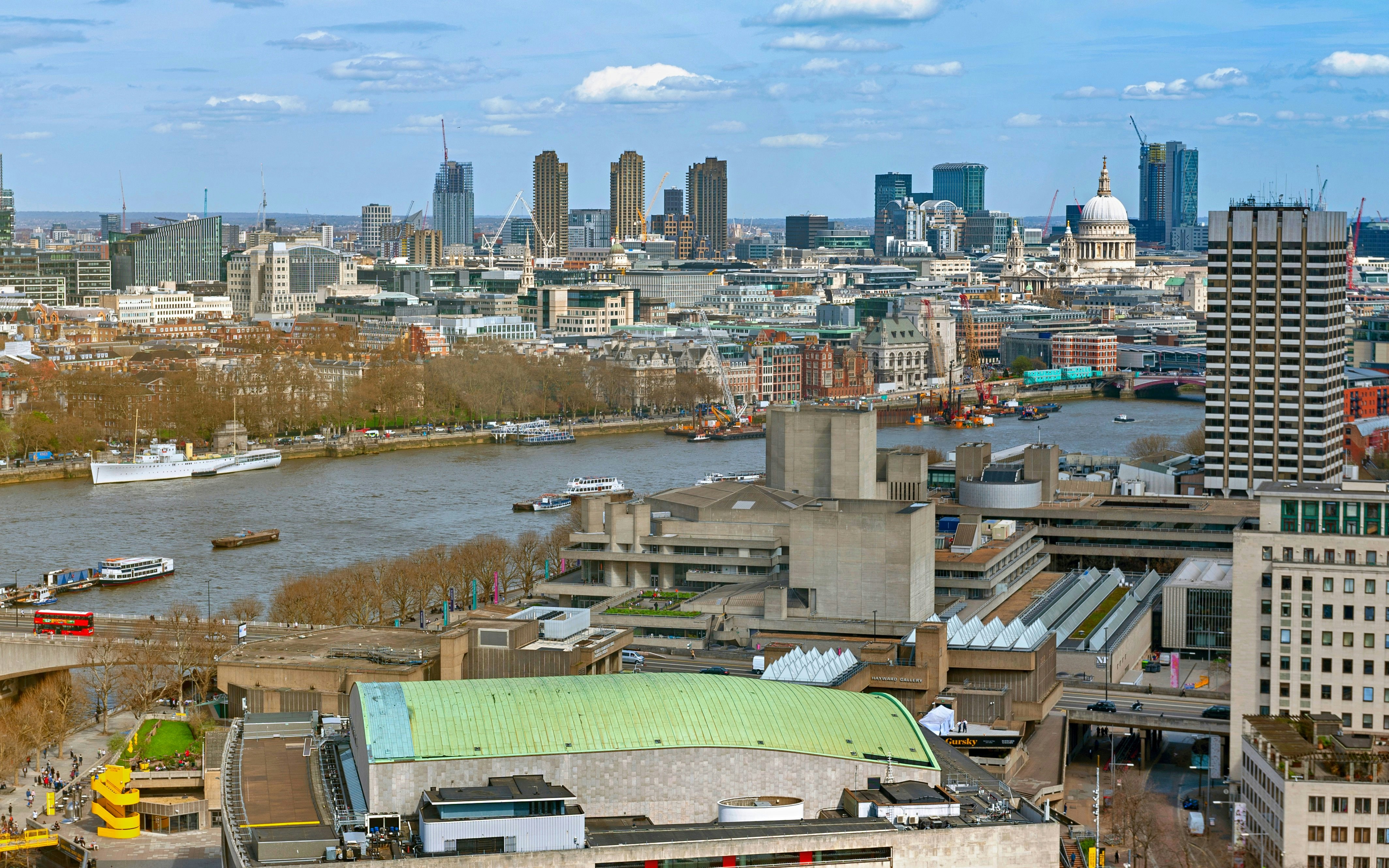 Aerial view of London skyline with the Thames River and St. Paul's Cathedral.