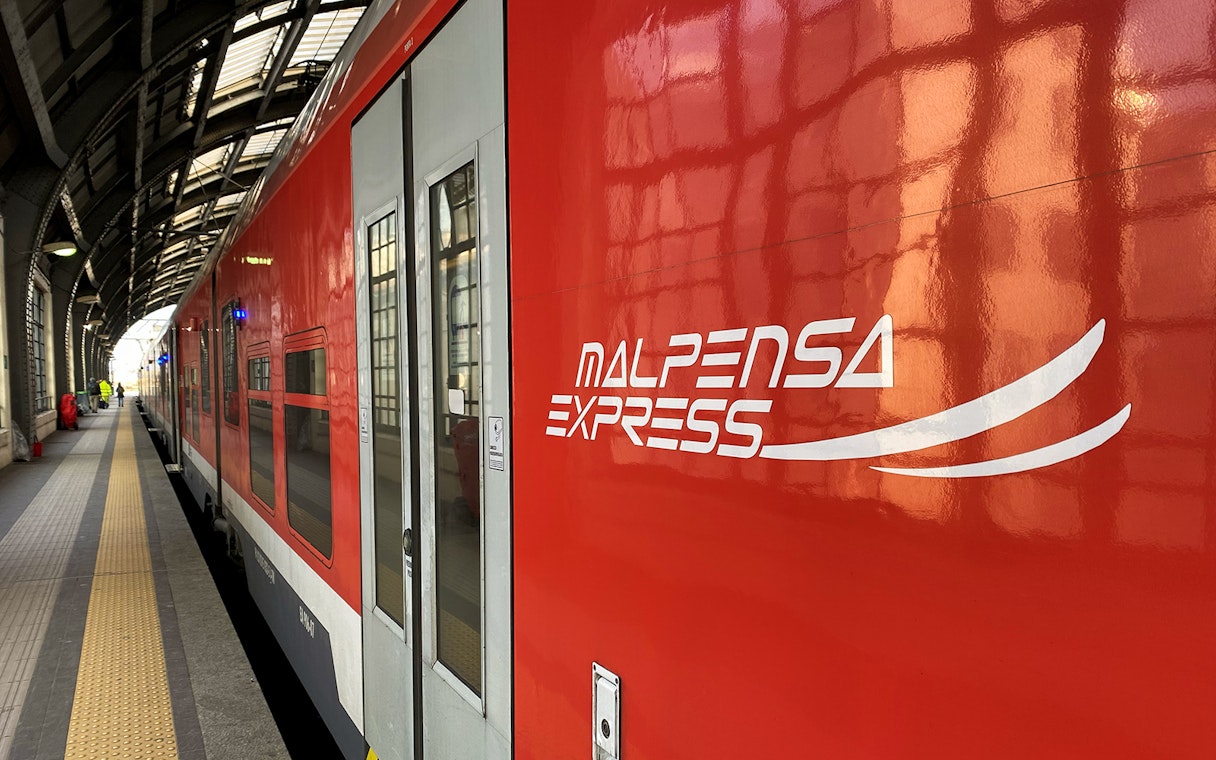 Malpensa Express train at Milan station platform.